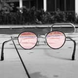 Glasses with rose colored lenses