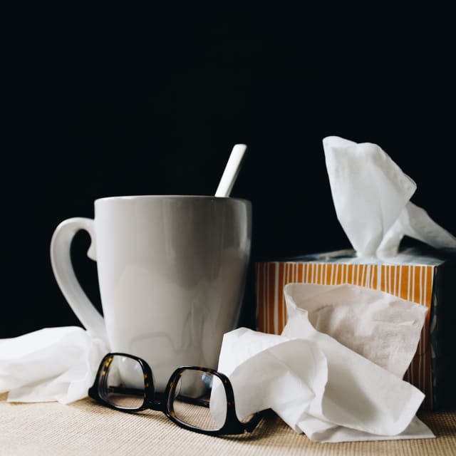 Coffee mug and a box of tissues