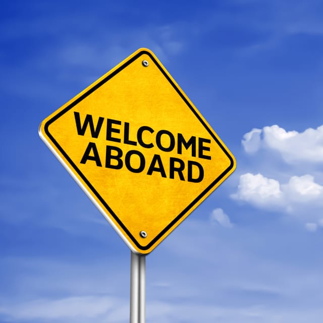 Road sign with the text "WELCOME ABOARD"