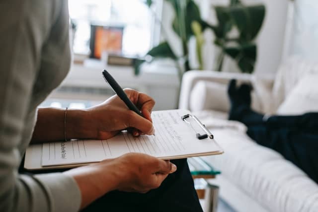 Therapist taking notes