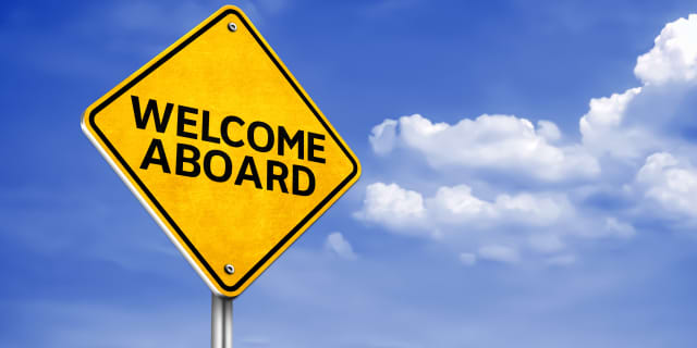 Road sign with the text "WELCOME ABOARD"